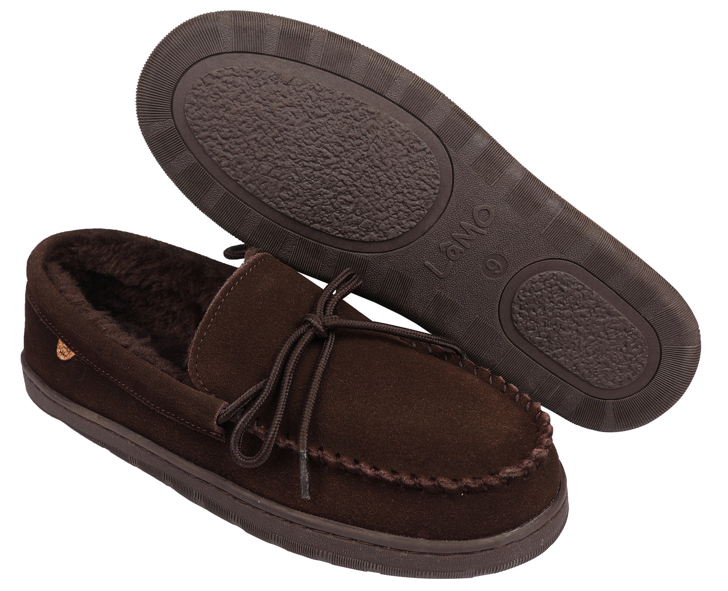 A pair of brown moccasin slippers, one laid on its side showing the sole and a tie closure, the other upright.