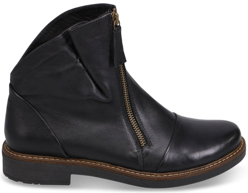 A black leather ankle boot with a slanted silhouette, a front-facing gold-tone zipper, and a dark, thick rubber sole with a visible stitched welt.