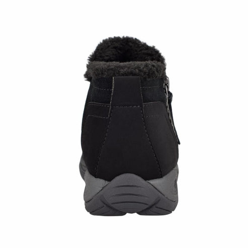 Back view of a black ankle boot with fur lining and side zipper.