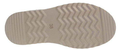 The sole of a shoe features a zig-zag pattern and the number 38.