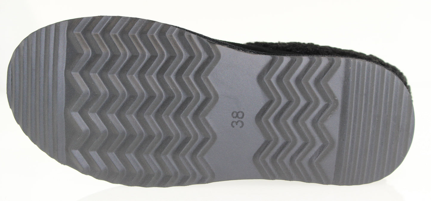 The bottom of a shoe with a thick, gray sole with a wavy, zigzag pattern, and the number 38 printed on the sole.