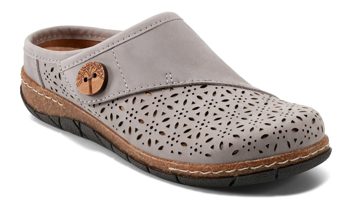 Grey slip-on shoe with decorative holes and a circular button.