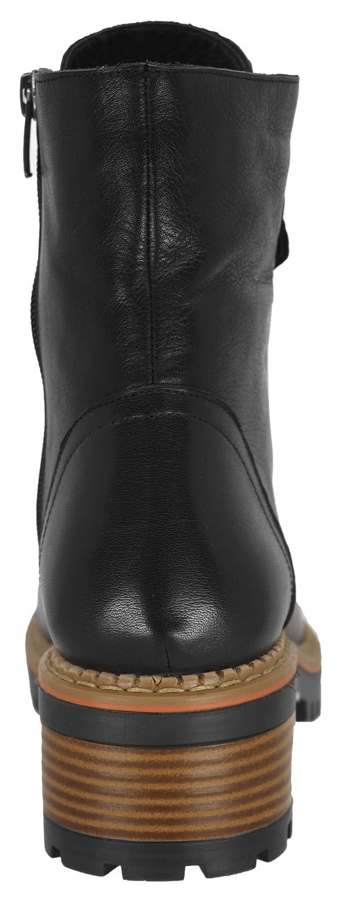 A back view of a black ankle boot with a chunky lug sole.
