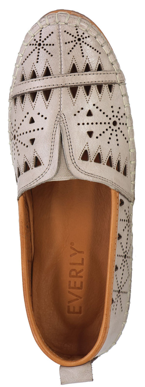 Top-down view of a tan slip-on shoe with perforated, geometric decorations and light-brown inner sole featuring the text EVERLY.