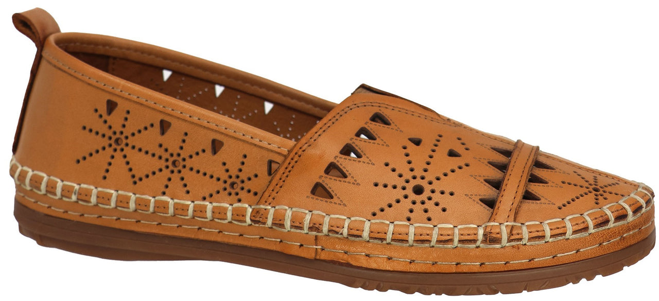 A tan-colored flat shoe with laser-cut designs.