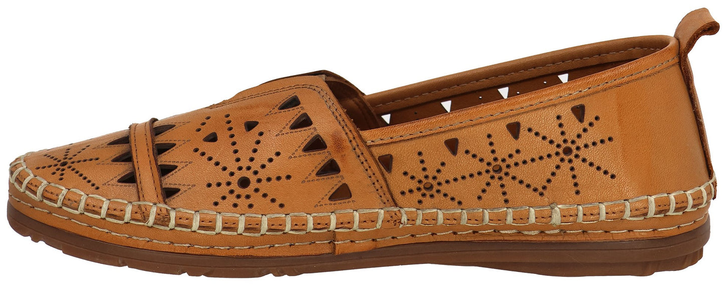 A tan slip-on shoe with cut-out floral designs.