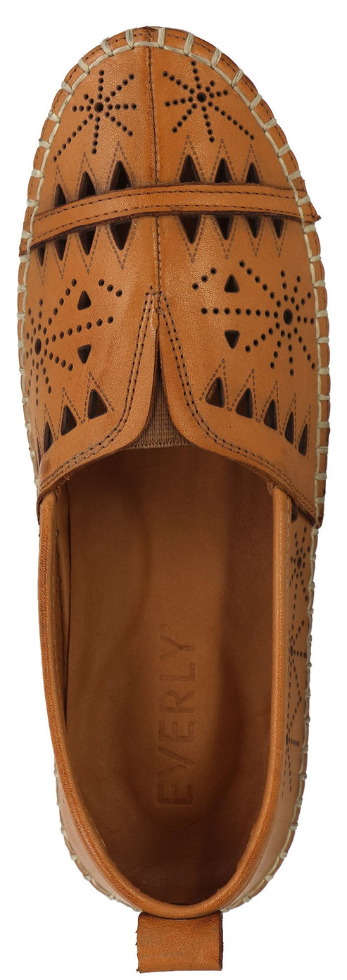 A tan leather shoe with patterned perforations.