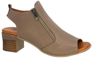 Peep-toe heeled sandal with a zipper closure, slingback heel, and wood-like block heel.