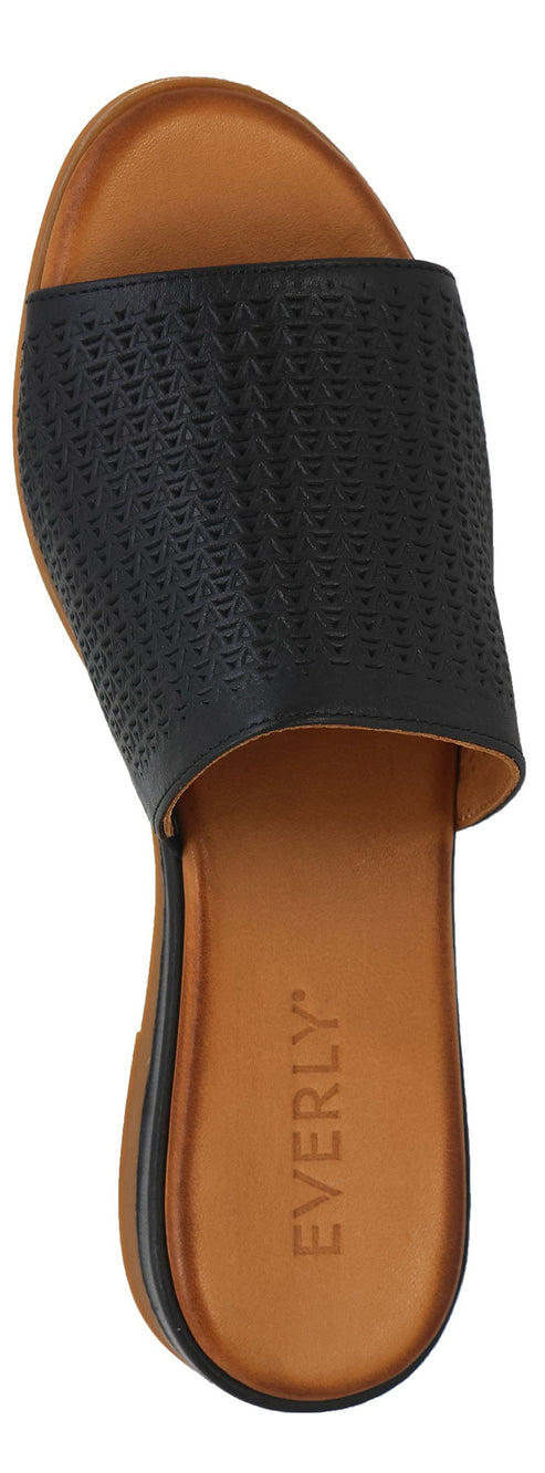 A top-down view of a slide sandal with a dark upper and a brown sole with EVERLY written on it.