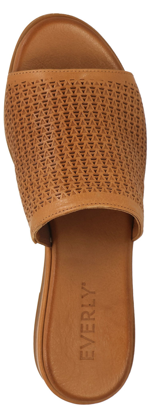 A tan colored sandal with a wide strap, featuring small triangle cutouts.