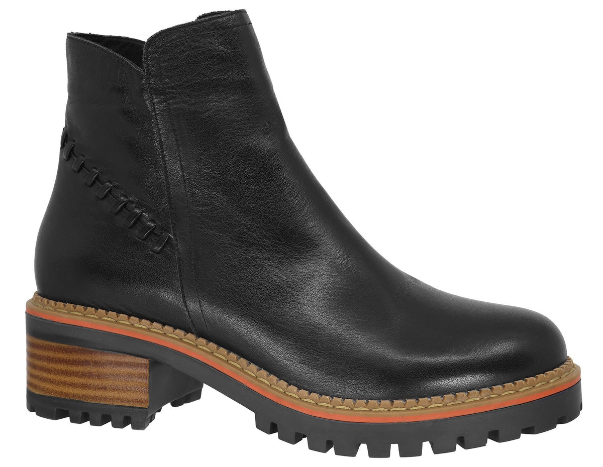 A black leather ankle boot with a rounded toe, a side zipper, decorative stitching along the heel seam, and a thick, lugged platform sole featuring a stacked wood-look heel and a thin orange accent stripe.