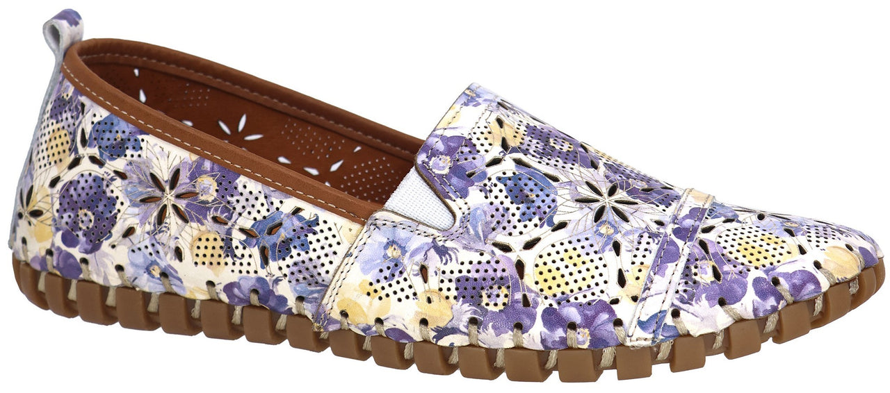 A floral-patterned slip-on shoe with a brown sole.