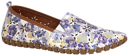 A floral-patterned slip-on shoe with a brown sole.