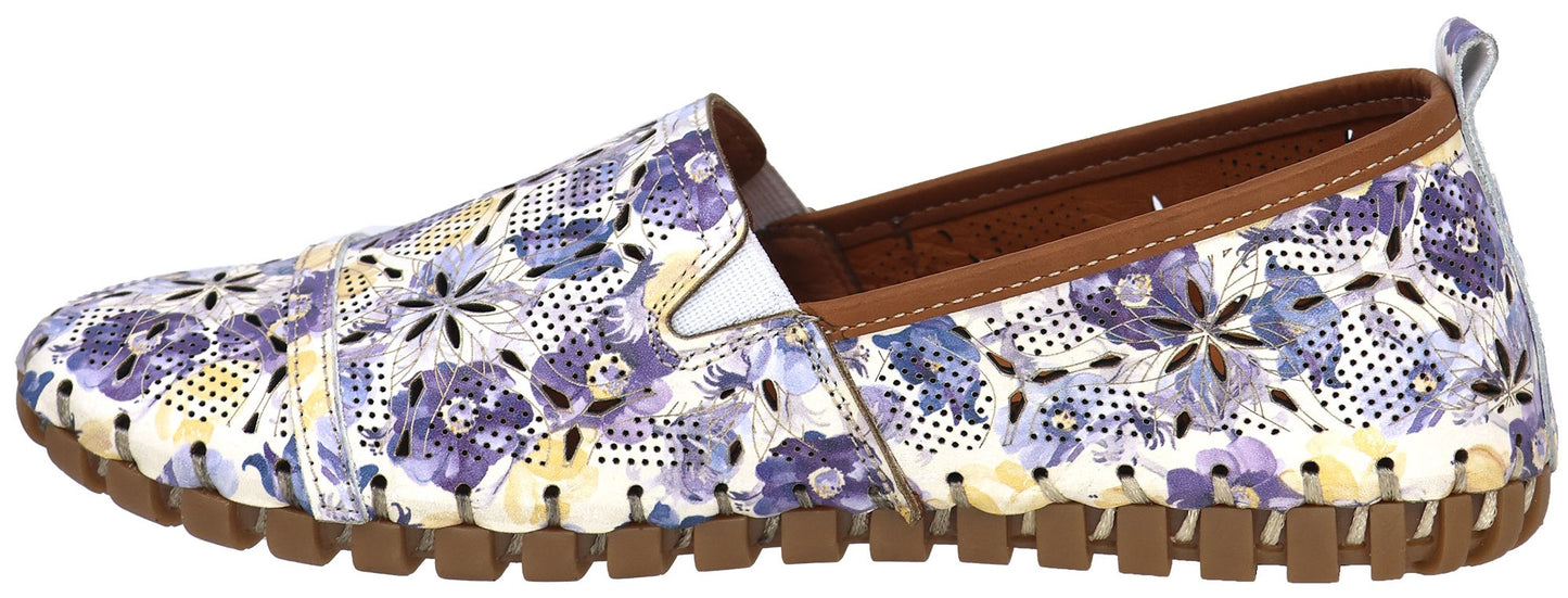 Floral print slip-on shoe with a perforated upper and a brown rubber sole.