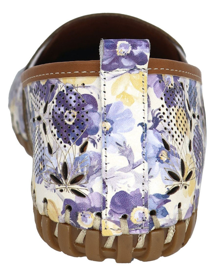 Floral-patterned slip-on shoe with brown sole and pull tab.