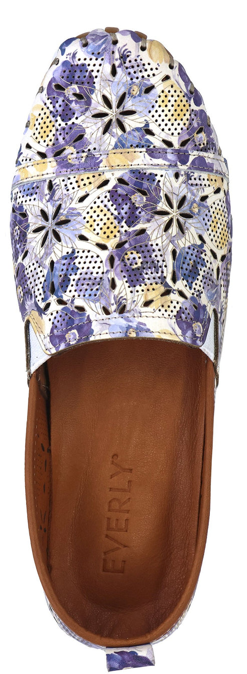 A close-up of a slide sandal with a floral upper.