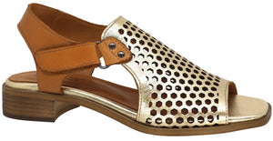 Gold sandal with tan ankle strap and a low block heel.