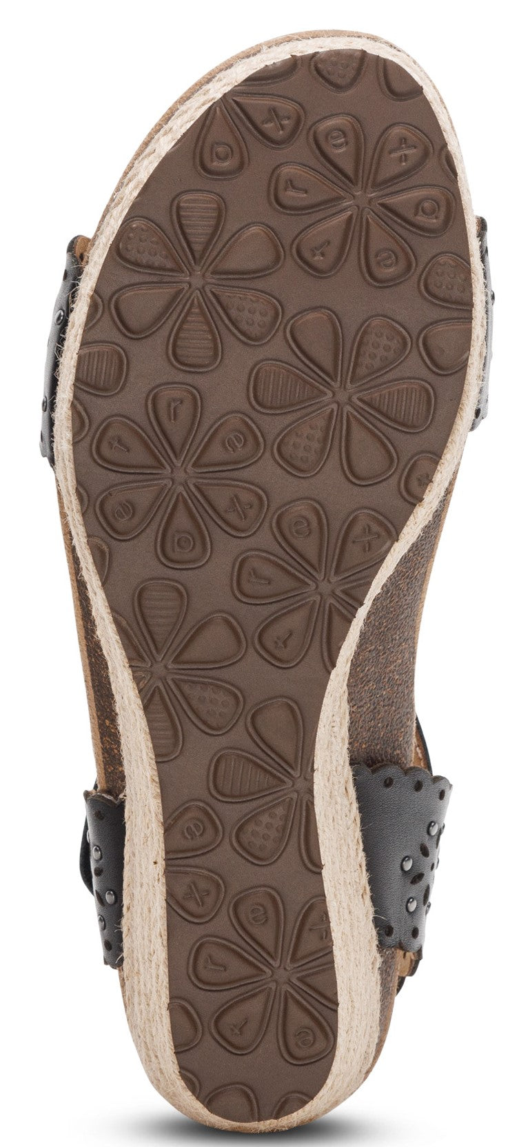 A sole of a sandal with a floral pattern.