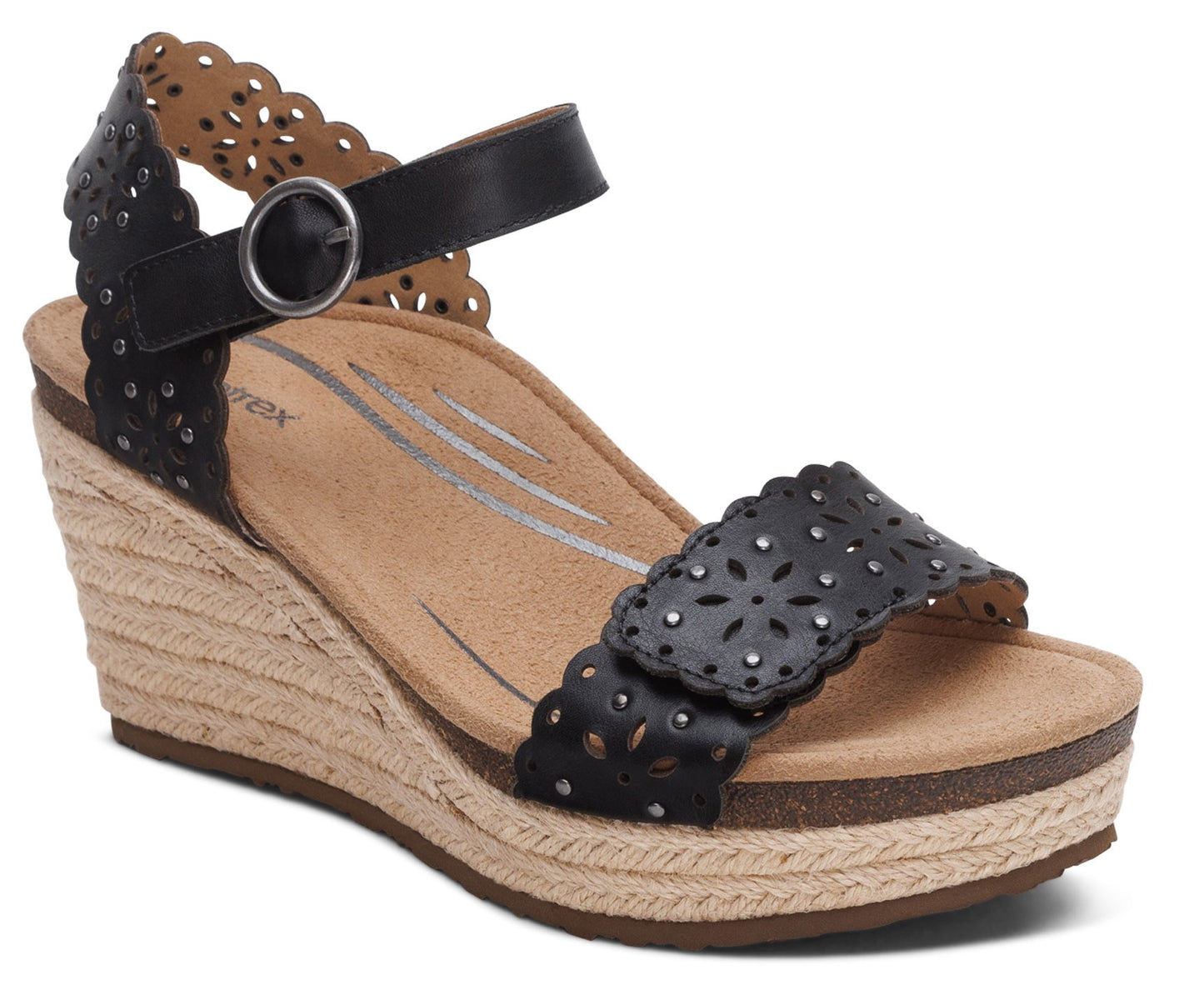 Black platform wedge sandal with ankle strap and a floral laser cut design.