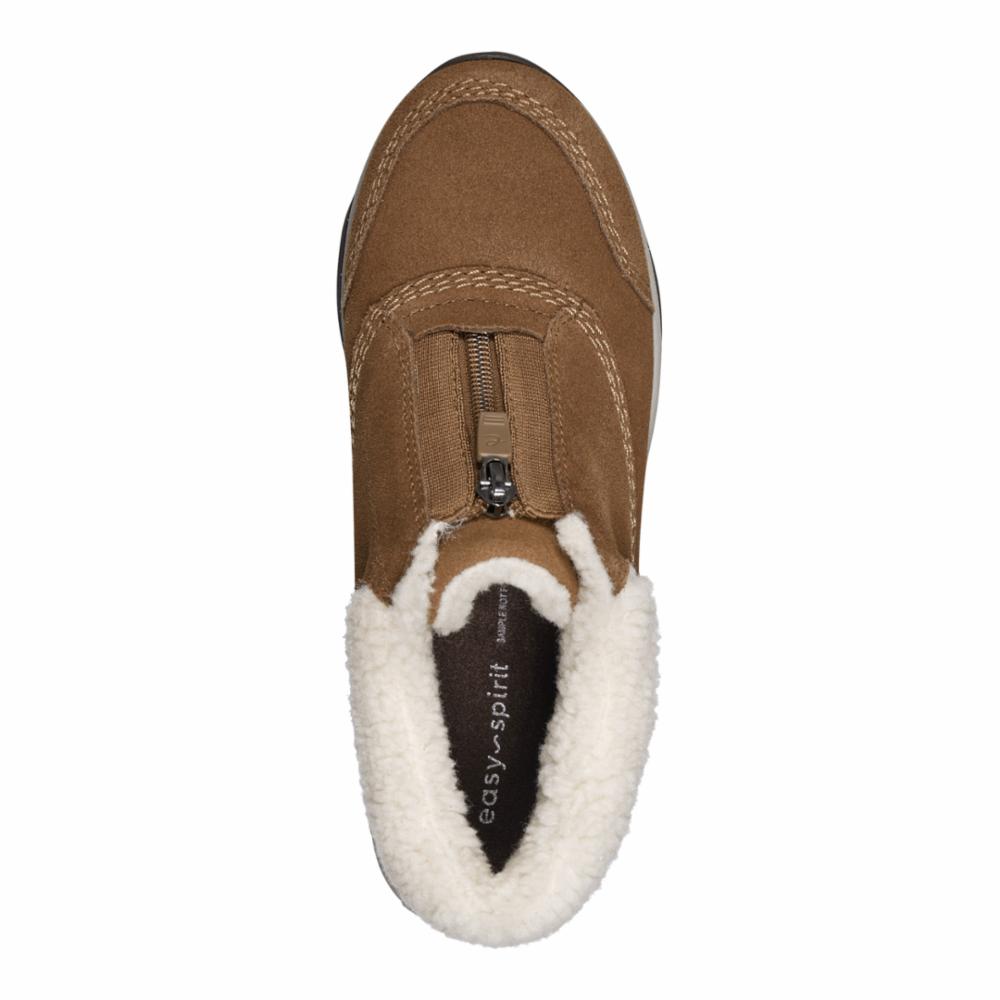 Tan suede slipper with a white faux fur lining and a front zipper