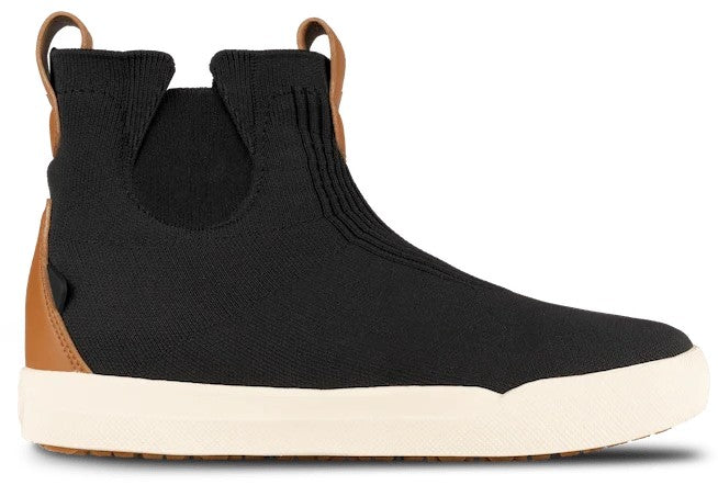 A black knit sneaker-boot with a tan leather heel cup and pull tabs at the ankle, featuring a thick off-white rubber sole.
