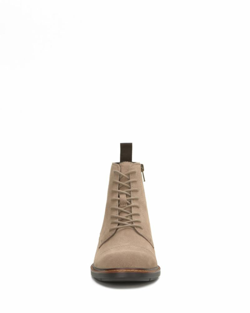 Front view of a light brown suede leather lace-up boot with a zipper.