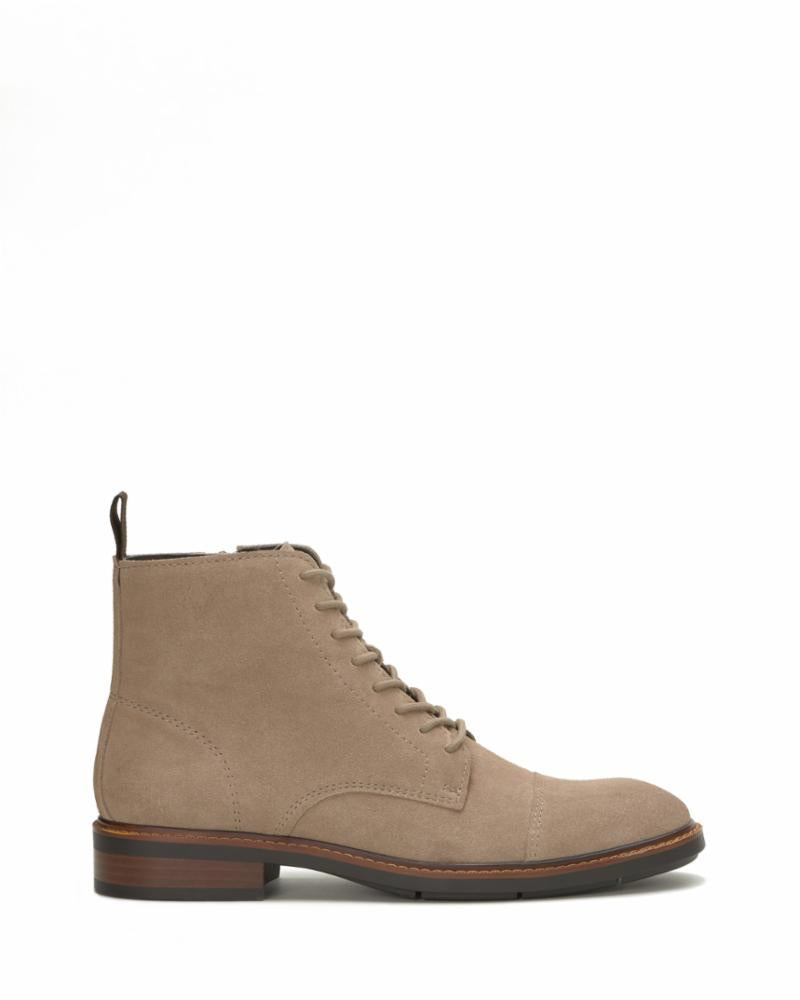 Light brown suede boot with cap toe and lace-up closure.