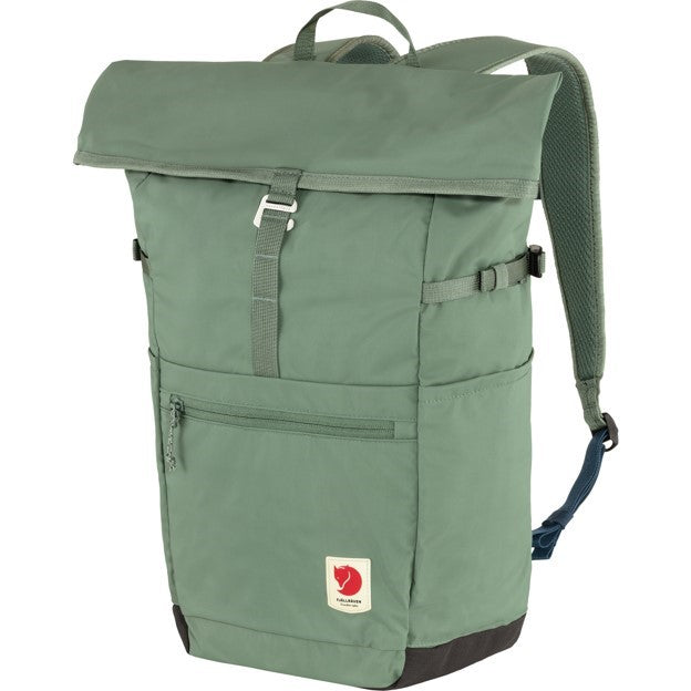 Green roll-top backpack with front zipper pocket and small rectangular logo.