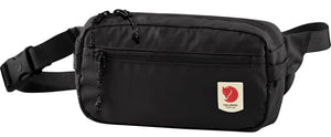 A black fanny pack with a buckle strap and a logo patch.