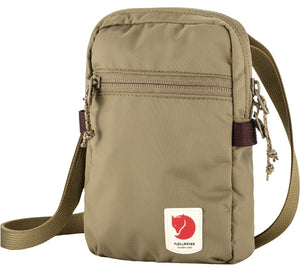 Khaki vertical small bag with a shoulder strap, a top zipper, a front zipper and a logo with a red fox.