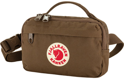 Brown Kånken hip pack with white and red logo on front and adjustable strap.