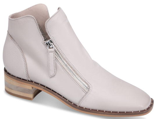 Light gray ankle boot with side zipper and low stacked heel.