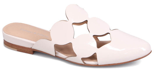 Slip-on shoe with circular design and low heel.