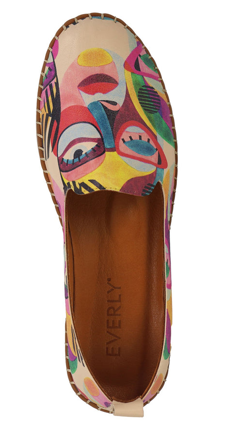 Top-down view of an abstract colorful slip-on shoe with “EVERLY” printed on the insole.