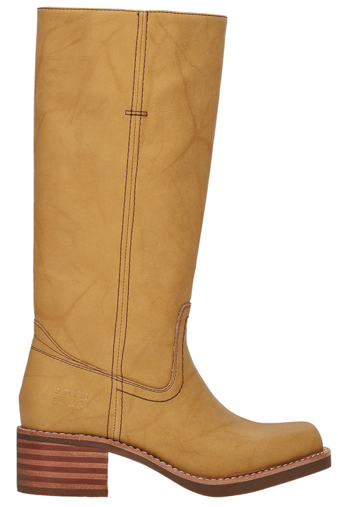 Knee-high tan leather boot with block heel and stitch detailing.
