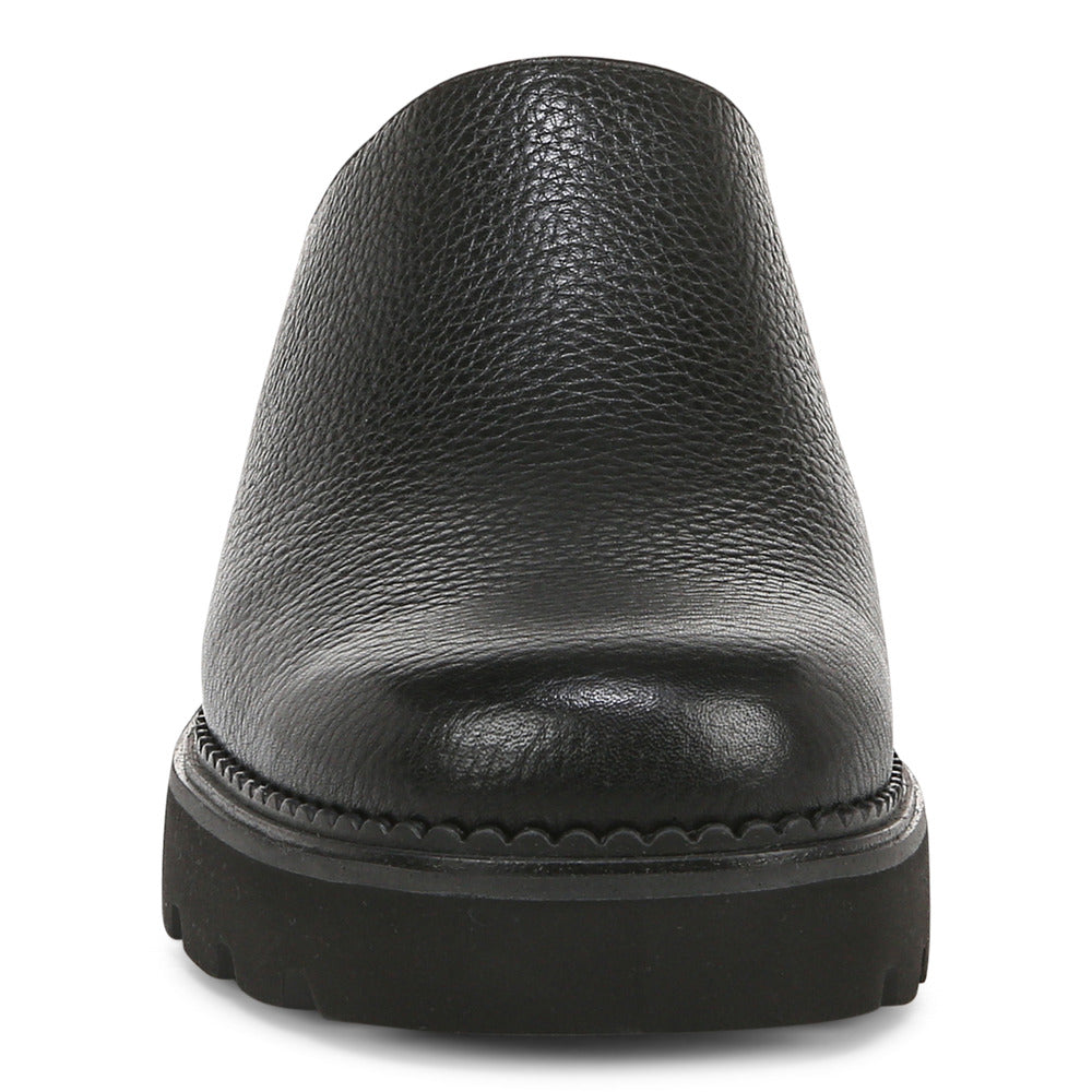 Black leather slip-on shoe with a platform sole.