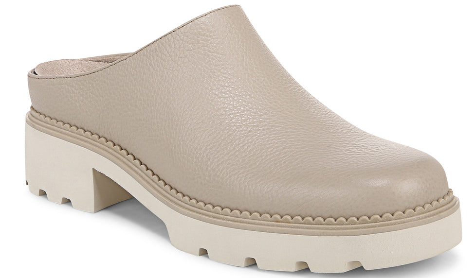A beige leather clog with a white chunky lug sole and block heel.