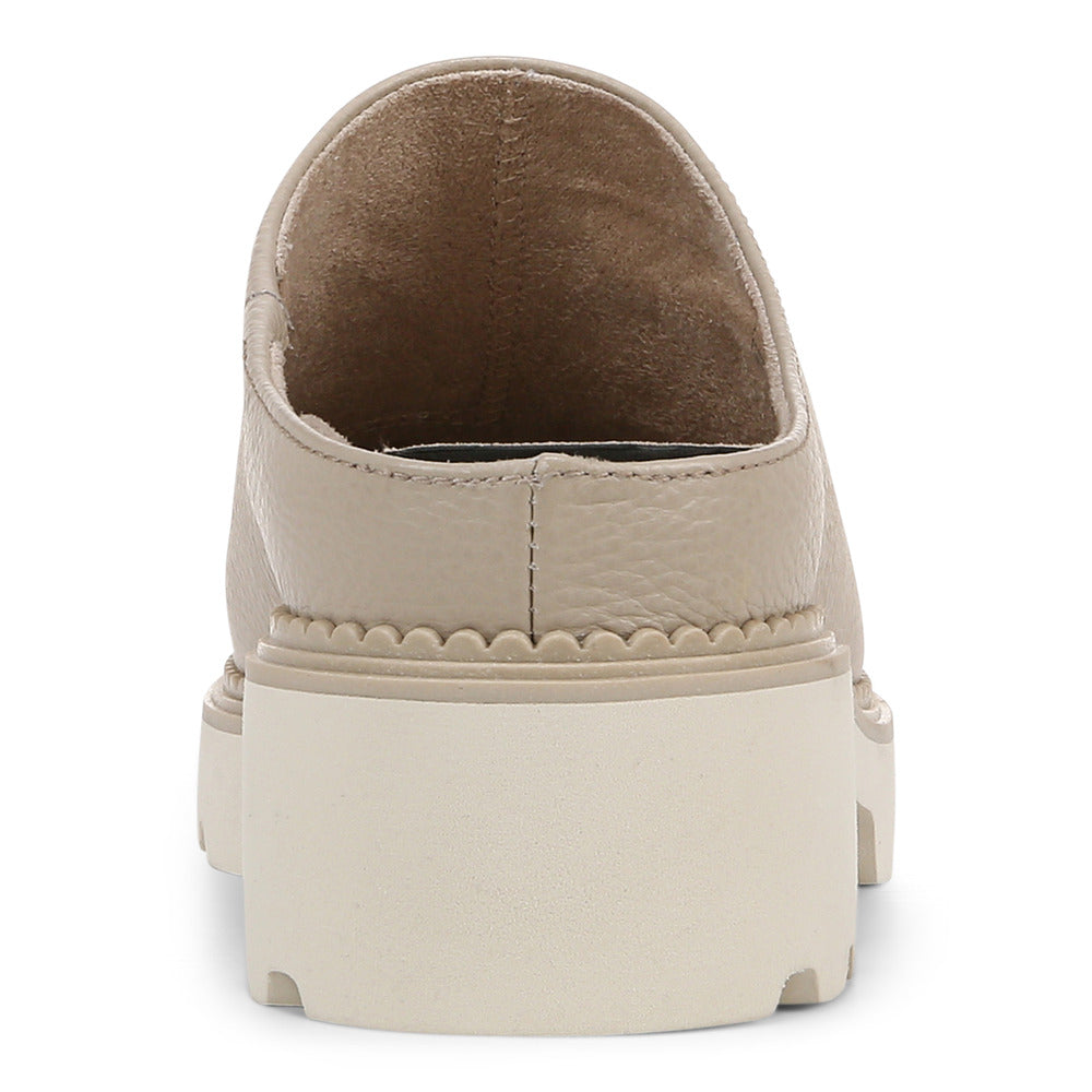 Beige leather mule with a thick, ridged white platform sole.