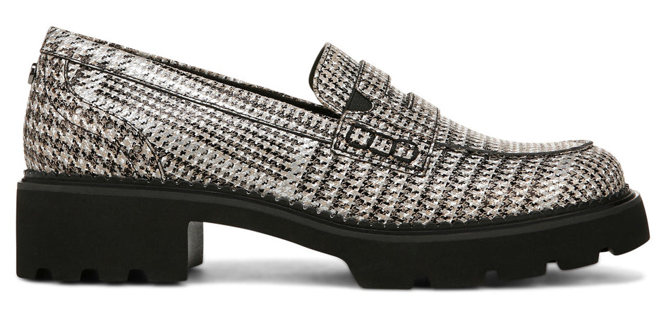 A houndstooth patterned loafer with a thick black lug sole.