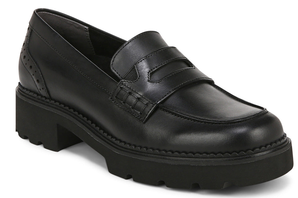Black leather penny loafer with lug sole platform and stacked heel.
