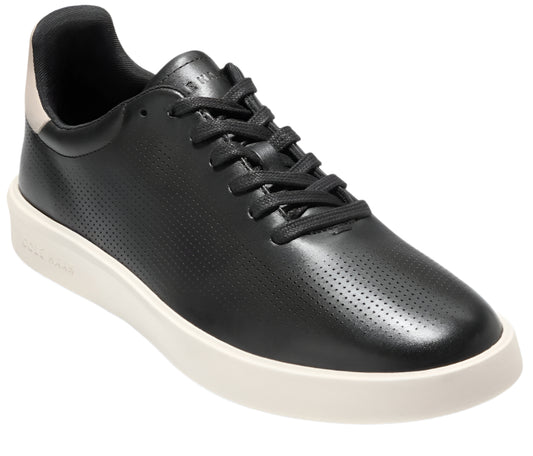 Black leather low-top sneaker with perforations, white sole and black laces.