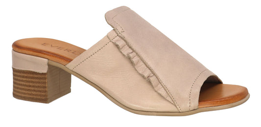 A beige heeled mule with a ruffle detail.