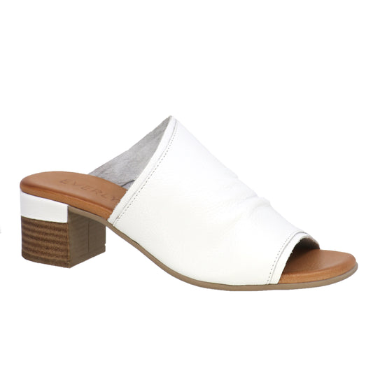 White slip-on sandal with a block heel.