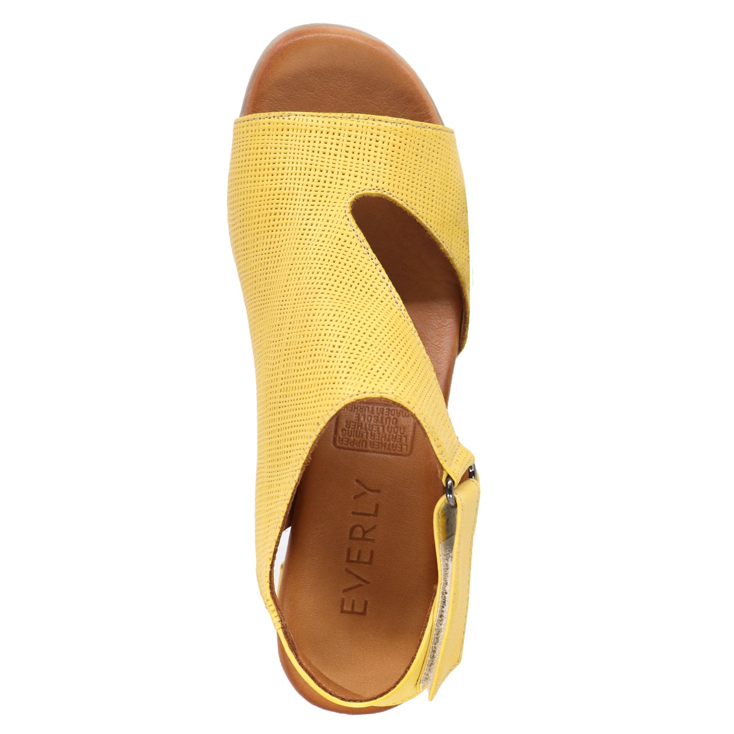 Top-down view of a yellow sandal with a side zipper and an open toe area.