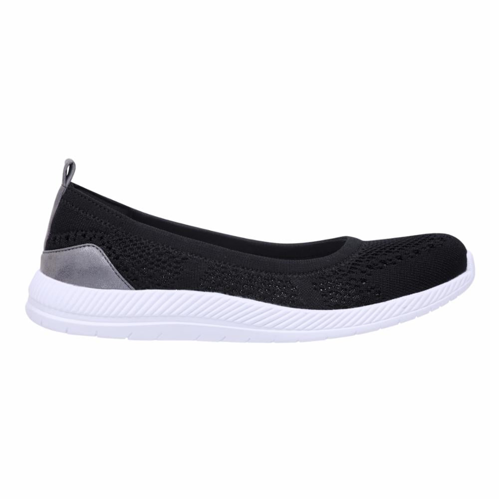 Black knit ballet flat with a white sole and metallic accent on the heel.