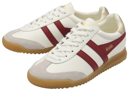 Pair of low-top, off-white sneakers with maroon stripes, tan soles, and visible laces.