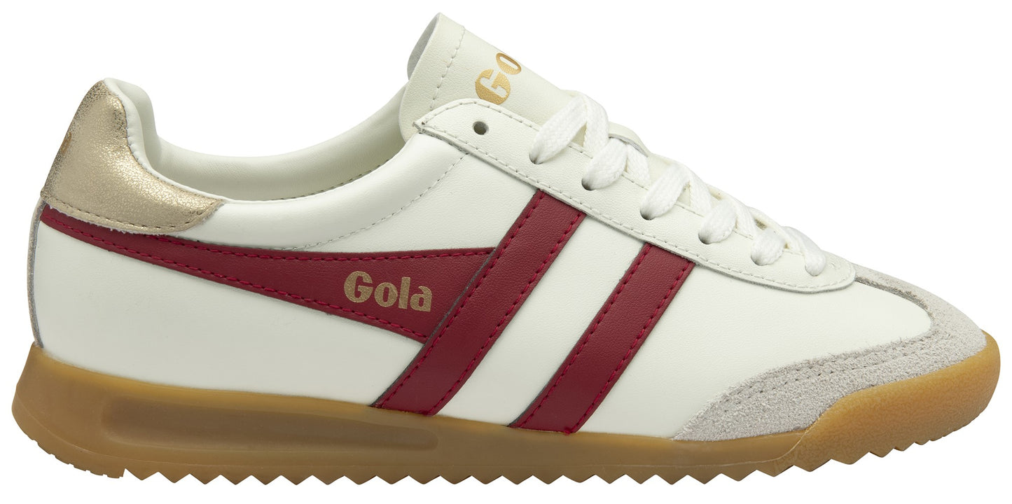 A low-top sneaker with white body and red stripes, gold heel and Gola text.