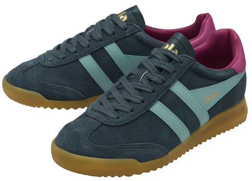 A pair of gray suede sneakers with mint green stripes and brown soles, and gold logo on the side and heel.