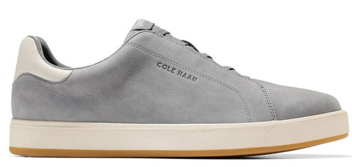 Gray leather sneaker with white heel and tan sole.
