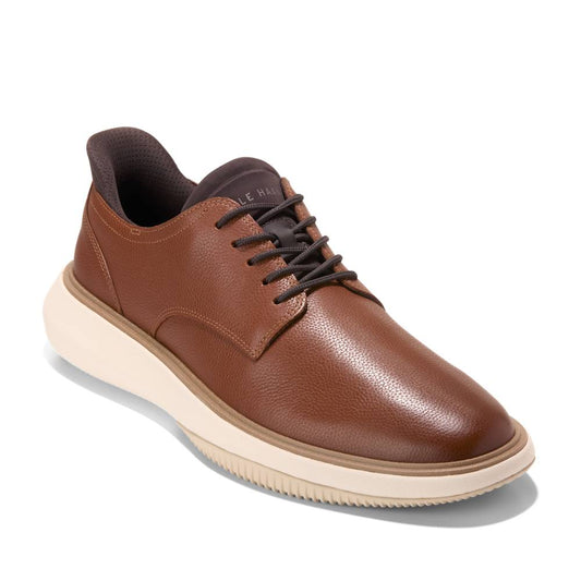Brown leather shoe with black laces and thick white sole.